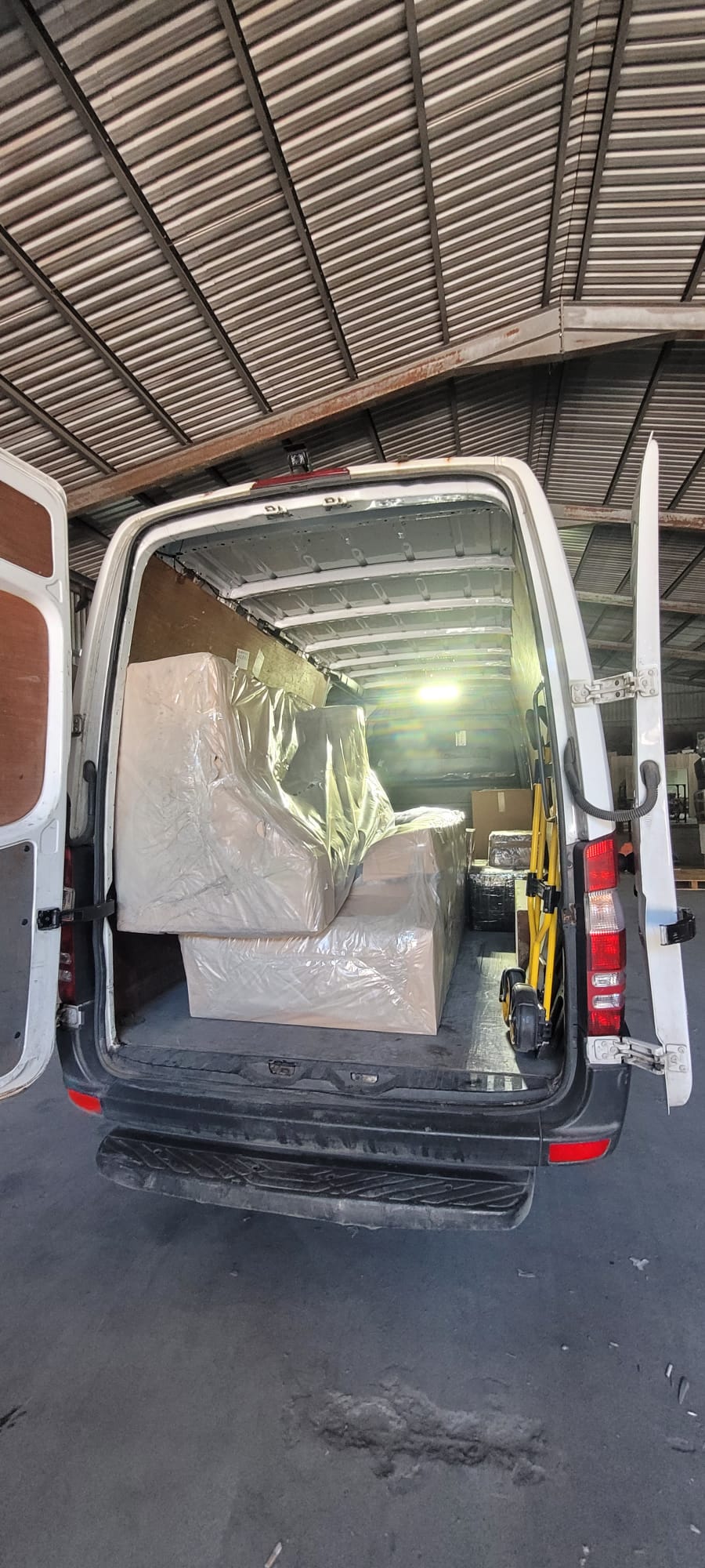 Van interior loaded with parcels